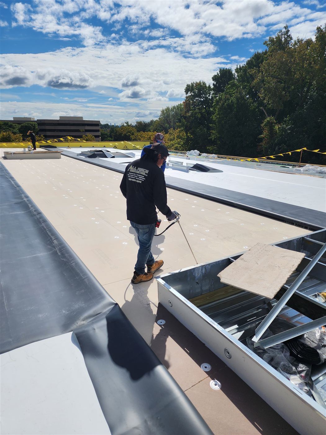 Roofer working around skylights