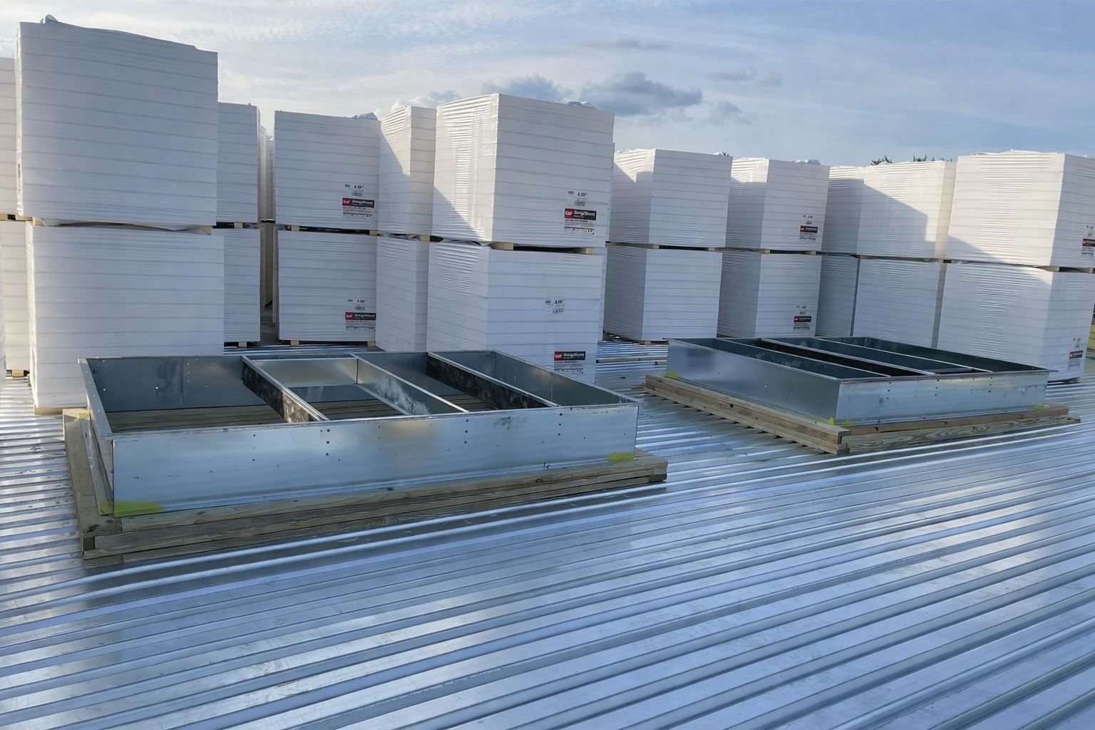 Insulation staged on a metal roof deck